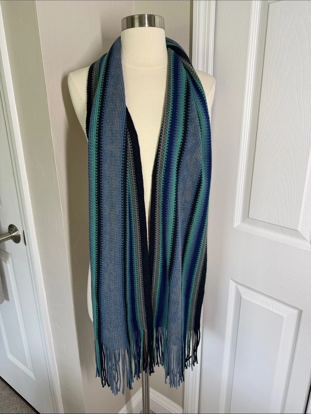 Blue and green striped knit scarf with fringe